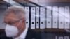 Files are pictured in the courtroom before the start of the trial against Gambian defendant Bai Lowe, accused of of crimes against humanity, murder and attempted murder, on April 25, 2022 in Celle, northern Germany.