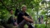 Nguyen Ngoc Anh, 36, who was an illegal logger turned forest protector poses at Phong Nha National Park, Quang Binh province, Vietnam, April 8, 2022. 