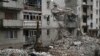 A man cleans debris of the destroyed house after recent Russian airstrike in Chasiv Yar, Ukraine, Nov. 27, 2022. 