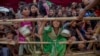 FILE - Rohingya children, who crossed over from Myanmar into Bangladesh, wait squashed against each other to receive food handouts at Thaingkhali refugee camp, Bangladesh, Oct. 21, 2017.