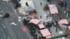 German Chancellor Angela Merkel and other government members visit the site of the attack in Berlin, Germany, Dec. 20, 2016, the day after a truck ran into a crowded Christmas market and killed several people. 