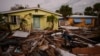 FILE - Debris from homes destroyed by Hurricane Milton lies strewn around still-standing houses on Manasota Key, Florida, Oct. 12, 2024.
