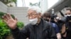 Catholic Cardinal Joseph Zen leaves after an appearance at a court in Hong Kong as he was charged in relation to their past fundraising for activists, May 24, 2022.