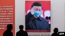 中國治理新冠病毒展覽上掛出的習近平照片(2021年1月15日）