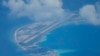 FILE - An airstrip made by China is seen beside structures and buildings at the man-made island on Mischief Reef at the Spratlys group of islands in the South China Sea are seen on March 20, 2022.