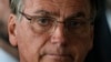 FILE - Brazilian President Jair Bolsonaro looks on after speaking from his official residence the Alvorada Palace in Brasilia, Brazil, Nov. 1, 2022. 