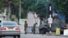 A military tank is seen with armed soldiers on a road leading to President Robert Mugabe's office in Harare, Zimbabwe, Nov. 15, 2017.