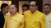 In this file photo taken on April 11, 2019, Thailand's Prime Minister Prayuth Chan-ocha holds hands with Deputy Prime Minister and Defence Minister Prawit Wongsuwan as they take part in water-pouring blessing ahead of Songkran festival at Government House in Bangkok.