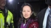 FILE - Huawei Technologies Chief Financial Officer Meng Wanzhou as she exits the court registry following the bail hearing at British Columbia Superior Courts in Vancouver, British Columbia on Dec. 11, 2018.