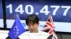 A monitor displays the exchange rate of the Japanese yen against the British Pound as a trader works at a foreign exchange brokerage in Tokyo, Japan, June 24, 2016.
