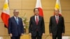 Philippine Foreign Secretary Teodoro Locsin, left, and Defense Secretary Delfin Lorenzana meet Japanese Prime Minister Fumio Kishida, center, at the official residence in Tokyo, Friday, April 8, 2022. (Kimimasa Mayama, Pool via AP)