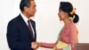 Leader of the National League for Democracy party (NLD) and Myanmar's new foreign minister, Aung San Suu Kyi, shakes hands with Chinese Foreign Minister Wang Yi, left in Naypyitaw, Myanmar, April 5, 2016. 