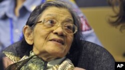 In this photo taken on Oct. 19, 2011 released by the Extraordinary Chambers in the Courts of Cambodia, Ieng Thirith smiles during a hearing in Phnom Penh.