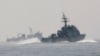 FILE - South Korean Navy's patrol ships search for survivors from the sunken South Korean navy ship near South Korea's Baekryeong island, March 29, 2010. 