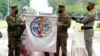Philippine and US officers unfurl the 'Balikatan' or 'Shoulder to Shoulder' flag during opening ceremonies of military exercises Camp Aguinaldo, Quezon City, Philippines, March 28, 2022.