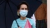 FILE - Myanmar Leader Aung San Suu Kyi leaves after the Central Executive Committee meeting at her National League for Democracy (NLD) party headquarters in Naypyitaw, Myanmar on July 21, 2020.