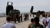 Фото: американська система HIMARS та японська 12SSM на виставці в Японії, червень 2022 року. REUTERS/Issei Kato