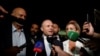 Malta's former Prime Minister Joseph Muscat speaks to the press outside the Law Courts on the day of the arraignment over corruption charges in connection with a hospital privatisation scandal dating back to 2015, in Valletta, Malta May 28, 2024. 