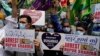 Indian Muslims hold placards demanding the arrest of Nupur Sharma, a spokesperson of governing Hindu nationalist party as they react to the derogatory references to Islam and the Prophet Muhammad made by her during a protest in Mumbai, June 6, 2022. 