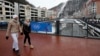 People walk at the Rosa Khutor Alpine Resort in Krasnaya Polyana near Sochi, Jan. 26, 2014. 