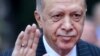 Turkey's President Recep Tayyip Erdogan waves to the crowd during a welcome ceremony in Sarajevo, Bosnia, Tuesday, Sept. 6, 2022. y
