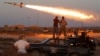 Fighters of Libyan forces allied with the U.N.-backed government fire a rocket at Islamic State fighters in Sirte, Libya, August 4, 2016.