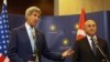 Turkey's Minister of Foreign Affairs Mevlut Cavusoglu, right, and U.S. Secretary of State John Kerry speak to the media before a meeting in Ankara, Turkey, Sept. 12, 2014.