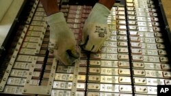 A battery production engineer at Nunam assembles a refurbished battery pack, made from used electric vehicle batteries, at their facility in Bengaluru, India, Oct. 8, 2024.