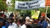 People march under a banner that reads "Stop Racist Police Terror," Baltimore, Maryland, May 2, 2015. (R. Muntu/VOA)