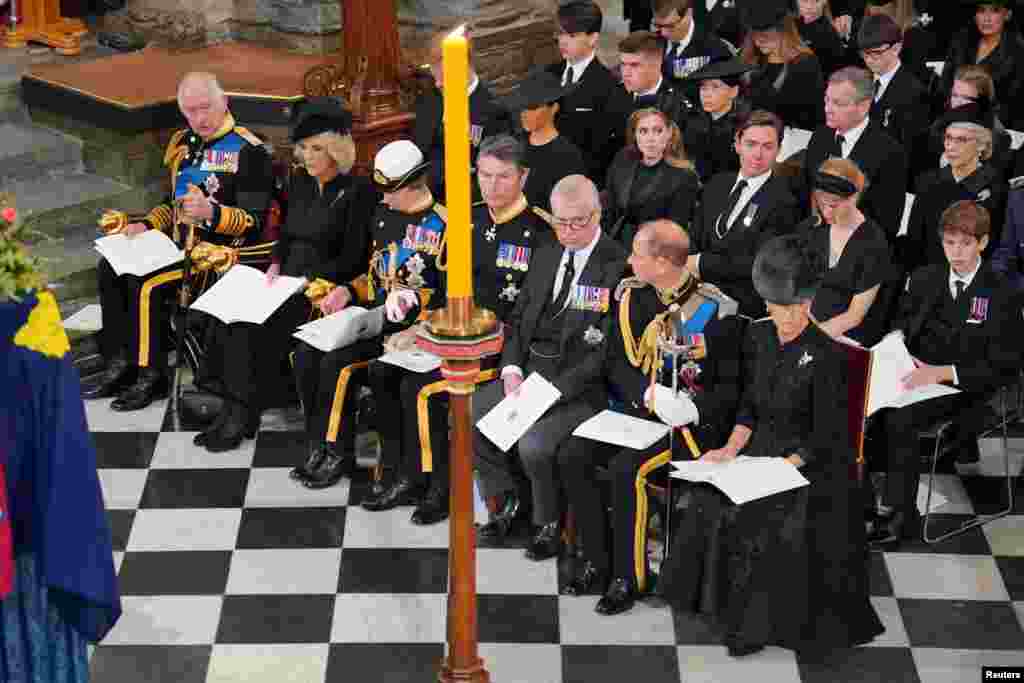 King Charles, the Queen Consort and senior royal family members are seen in front of the coffin of Queen Elizabeth during her State Funeral at the Abbey in London, Sept. 19, 2022.