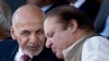 FILE - Afghan President Ashraf Ghani (l) talks with Pakistani Prime Minister Nawaz Sharif in Islamabad, Pakistan, Nov. 15, 2014. 