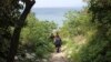 FILE - Islamist fighters are seen in Latakia province, Syria, not far from the Turkish border, March 31, 2014.