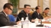 This picture released June 24, 2022, by the Korean Central News Agency shows North Korean leader Kim Jong Un, center, at a meeting of the Eighth Central Military Commission of the Workers' Party of Korea, at the party's central committee headquarters in Pyongyang.