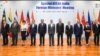 In this photo provided by Indian Foreign Minister S. Jaishankar's Twitter handle, Jaishankar, center, stands with Southeast Asian foreign ministers at the start of a meeting in New Delhi, India, Thursday, June 16, 2022.