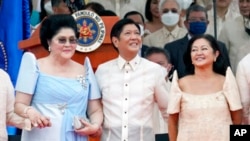 President Ferdinand Marcos Jr. stands with his mother Imelda Marcos, left, and his wife Maria Louise Marcos, right, during the inauguration ceremony at National Museum June 30, 2022 in Manila, Philippines.