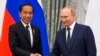 Russian President Vladimir Putin, right, and Indonesian President Joko Widodo shake hands after a joint news conference after their meeting in the Kremlin in Moscow, June 30, 2022.