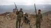 FILE - Armenian soldiers pose near a frontline in Nagorno-Karabakh, Azerbaijan, April 6, 2016. 