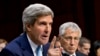 U.S. Defense Secretary Chuck Hagel (R) listens as Secretary of State John Kerry testifies on Capitol Hill in Washington, Sept. 3, 2013, before the Senate Foreign Relations Committee.