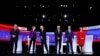 Democratic candidates stand on stage, Tuesday, Jan. 14, 2020, before a Democratic presidential primary debate hosted by CNN and the Des Moines Register in Des Moines, Iowa.