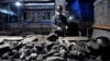 FILE - A worker sorts coal at a mine in Suzhou, China, on Oct. 20, 2021. China relies on coal for most of its energy production. U.S. climate envoy John Kerry described meetings with his Chinese counterpart as "productive," on Nov. 10, 2023.