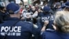 Protesters clash with police on a street in Sydney's central business district in Australia, September 15, 2012. 
