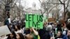 Students hold banners and posters during a demonstration against climate change in New York, March 15, 2019. 