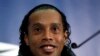 Brazilian national soccer team player Ronaldinho smiles during a news conference at Wembley stadium in London February 5, 2013. Brazil are set to play England in an international friendly soccer match on Wednesday. REUTERS/Stefan Wermuth (BRITAIN - Tags: