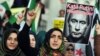 FILE - Turkish protesters shout anti-Russia slogans as they hold a poster of Russian President Vladimir Putin that reads in Turkish and Russian "Assassin Putin!" during a protest in Istanbul, Turkey, Nov. 27, 2015. 