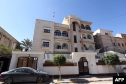 FILE - A view of the Serbian Embassy in Tripoli, Libya, Feb. 21, 2016. The day before, Libya's internationally recognized government condemned a U.S. airstrike west of Tripoli in Sabratha, believed to have killed Islamic State operative Noureddine Chouchane and dozens of others, calling it a violation of Libyan sovereignty. The strike also killed two kidnapped Serbian Embassy employees.