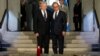 France's President Francois Hollande, right, stands with German President Joachim Gauck, left, as they pay respect in the crypt of the the National Monument of Hartmannswillerkop, in Wattwiller, eastern France, Aug. 3, 2014, to mark the 100th anniversary 