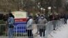 People line up to enter a tent erected to test for the coronavirus disease (COVID-19) at the Brooklyn Hospital Center in Brooklyn, New York City, March 19, 2020.
