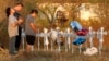 Miranda Hernandez (L) prays at sunset with father Kenneth and mother Irene at a row of crosses near the site of the shooting at the First Baptist Church of Sutherland, Texas, Nov. 6, 2017. 