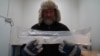 Joergen Peder Steffensen, professor of ice core-related research at the Niels Bohr Institute, University of Copenhagen, holds part of an ice core sample in the University of Copenhagen’s ice core repository in Copenhagen, Denmark, on Oct. 26, 2023.