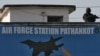 An Indian security personnel stands guard on a building at the Indian Air Force (IAF) base at Pathankot in Punjab, India, Jan. 5, 2016. 